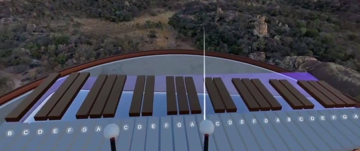 The Museverse marimba over a canyon at sunset with hot-air balloons